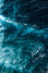 Aerial view to seething waves with foam. Waves of the sea meet each other during high tide and low tide - 459129859