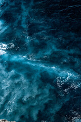 Aerial view to seething waves with foam. Waves of the sea meet each other during high tide and low tide - 459130009