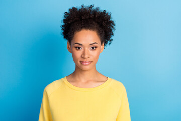 Photo portrait curly woman smiling in yellow shirt isolated pastel blue color background