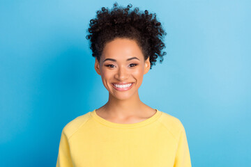 Photo of young happy woman good mood enjoy wear yellow jumper isolated on blue color background