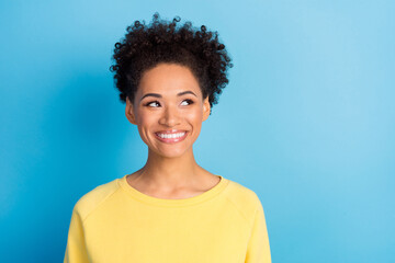 Photo of young dreamy happy woman look empty space cool enjoy isolated on blue color background