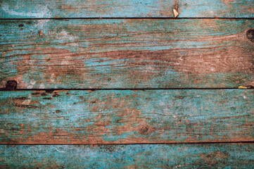 Textured design of wood planks in turquoise color. Barn background with copy space.