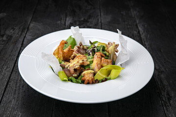 seafood salad on a dark table
