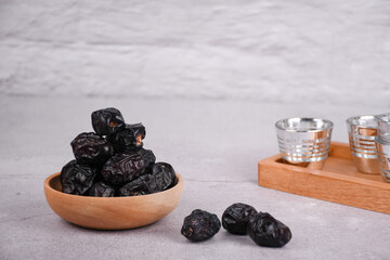 Juicy dates on a concrete background. Copy space, selective focus