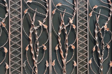 metal texture of black iron wall with brown forged pattern