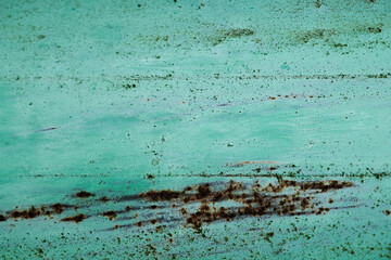 Fototapeta na wymiar Turquoise painted rusted metal sheet
