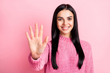 Photo portrait of woman showing palm five fingers isolated on pastel pink colored background