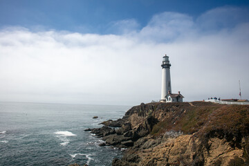 Naklejka premium Pigeon Point Lighthouse on the California Coast Highway, 1 Pacific Coast Highway, on the California Coast with Clouds in the Background