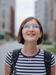 woman with brown hair outdoors.