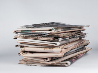 Pile of newspapers on white background. Journalist, isolated. Information. Stack