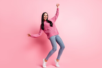 Full size photo of cheerful adorable girl dancing partying beaming smile isolated on pink color background