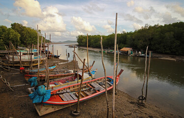 Twilight atmosphere with long tail boats parking at Klong Mudong Phuket.
