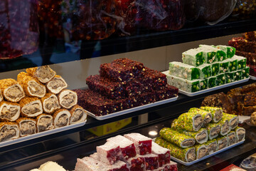 In front of store selling Turkish delight, various locum, arranged like pyramid, with knives,...