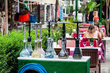 Nice colorful hookahs or shisha in the Bazaar, Turkey. Beautiful colored hookahs in the storefront. Ethnic painted shisha are for sale in the oriental market