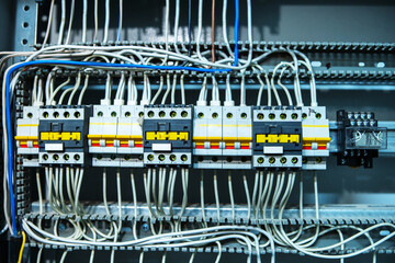 Switches and fuses in the switchboard. Wires and equipment for the control of electrical appliances. Close-up