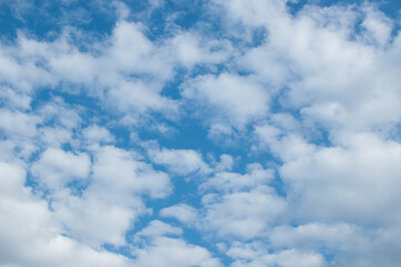 Beautiful background of blue sky during the day with fluffy clouds. Copy space