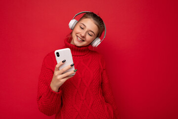 Photo shot of beautiful joyful smiling young female person wearing stylish casual outfit isolated...