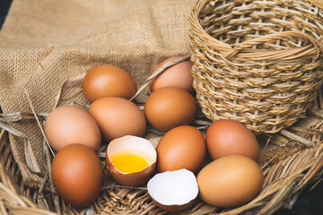 Fresh chicken eggs in a basket.