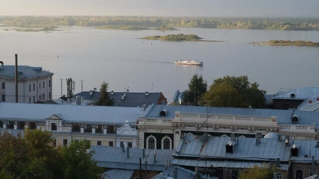 View from the Fedorovsky embankment to the tourist motor ship carrying tourists at sunset