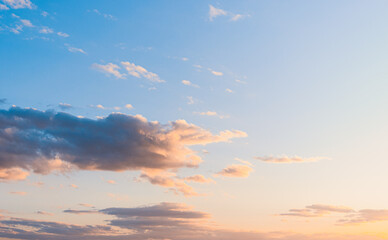 fluffy clouds on a sunset background with dramatic light.