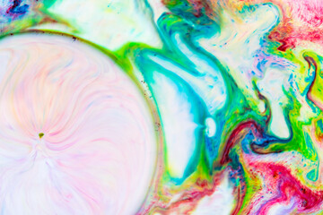 Multicolored lines and spots on liquid surface. Abstract background made with fluid art technique. Trendy colorful backdrop. Fluid art
