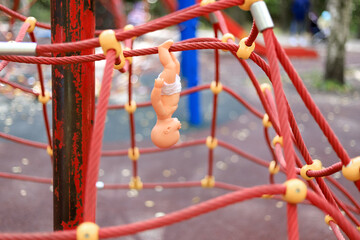 on the playground, a toy on a spider web