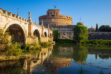 Fototapeta premium Along the banks of the Tiber River in Rome. Ancient bridges