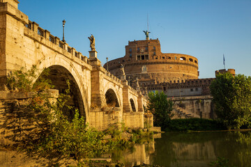 Fototapeta premium Along the banks of the Tiber River in Rome. Ancient bridges