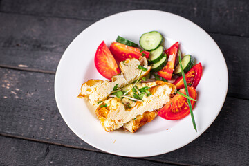 omelet vegetable fried eggs breakfast salad tomato, cucumber fresh meal snack on the table copy space food background 