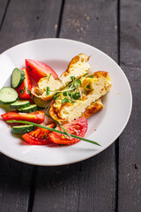 omelet vegetable fried eggs breakfast salad tomato, cucumber fresh meal snack on the table copy space food background 