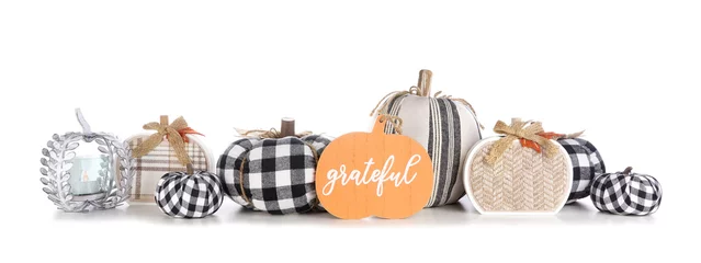Foto op Canvas Modern farmhouse thanksgiving decor. Border with black and white buffalo plaid and rustic fabric pumpkins with Grateful wood sign isolated on a white background. © Jenifoto
