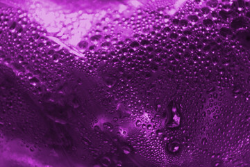 Purple abstract background from drops of water. Beautiful bright background.