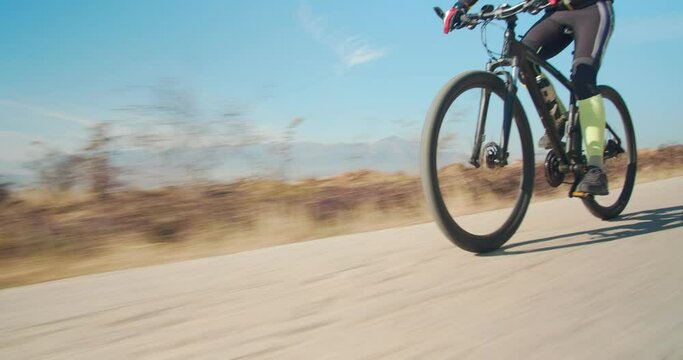 Man riding his bicycle in the mountains