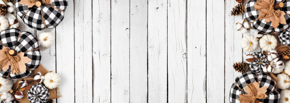 Modern farmhouse autumn double border over a white wood banner background. Black and white buffalo plaid pumpkins and rustic decor. Top view with copy space. - Powered by Adobe