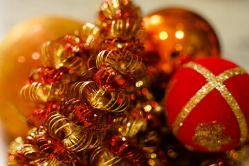 Red and orange tinsel and orange and red Christmas balls