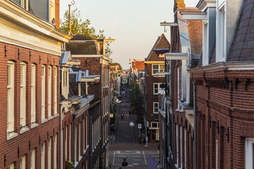 Fototapeta na wymiar Dutch houses at sunset in the city of Amsterdam, Netherlands