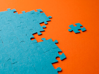 From chaos to order, concept. The puzzle element moves towards the correctly assembled puzzle. A...