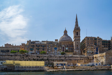 The Maramxett Harbour side of the fortified city of Valletta, the capitol of Malta.  Including the churches Basilica of Our Lady of Mount Carmel & St. Paul's Pro-Cathedral.