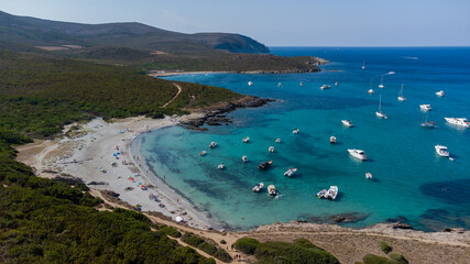 Aerial view of the Cala Genovese beach on the Cap Corse in Upper Corsica, France - Tourists...