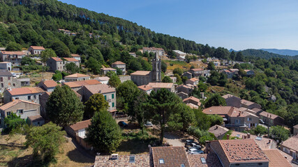 Fototapeta na wymiar Aerial view of the mountainous village of Zonza in the South of Corsica, France, with the Parish church of the Assumption in the center