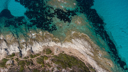 Naklejka na ściany i meble Aerial view of Saleccia Beach in the Agriates desert in Upper Corsica, France - Paradise beach in the Mediterranean Sea with tropical waters, only accessible by boat
