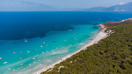 Fototapeta na wymiar Aerial view of Saleccia Beach in the Agriates desert in Upper Corsica, France - Paradise beach in the Mediterranean Sea with tropical waters, only accessible by boat