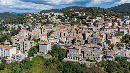 Fototapeta na wymiar Aerial view of the medieval city of Sartène in the mountains of the South of Corsica, France - Regional capital, Sartène is mostly made of granite buildings