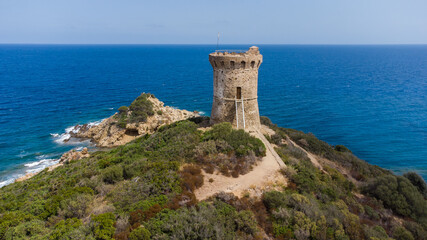 Fototapeta na wymiar Aerial view of the ruins of the round Genoese tower of Fautéa in the South of Corsica, France - Remains of a medieval lookout overlooking the Mediterranean Sea