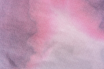 Trendy Tie-Dye fabric. Cotton background texture for design. Pink texture for any background. Ecologically grown cotton.