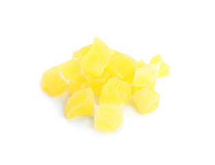 Delicious yellow candied fruit pieces on white background