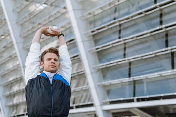 Man stretching upper body on sport training