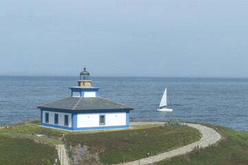Fototapeta na wymiar Seascape whit the lighthouse of 'Pancha island' in the coast of Ribadeo, Galicia, Spain