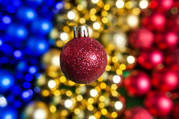 Fototapeta premium colored Christmas tree toys are scattered on the table