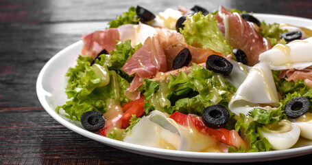 Delicious fresh salad with bacon for the festive table